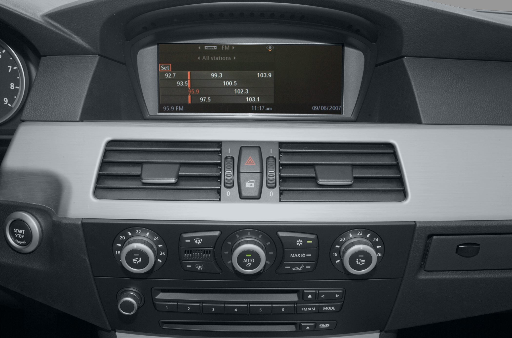 Car interior center console with climate controls and multifunction display