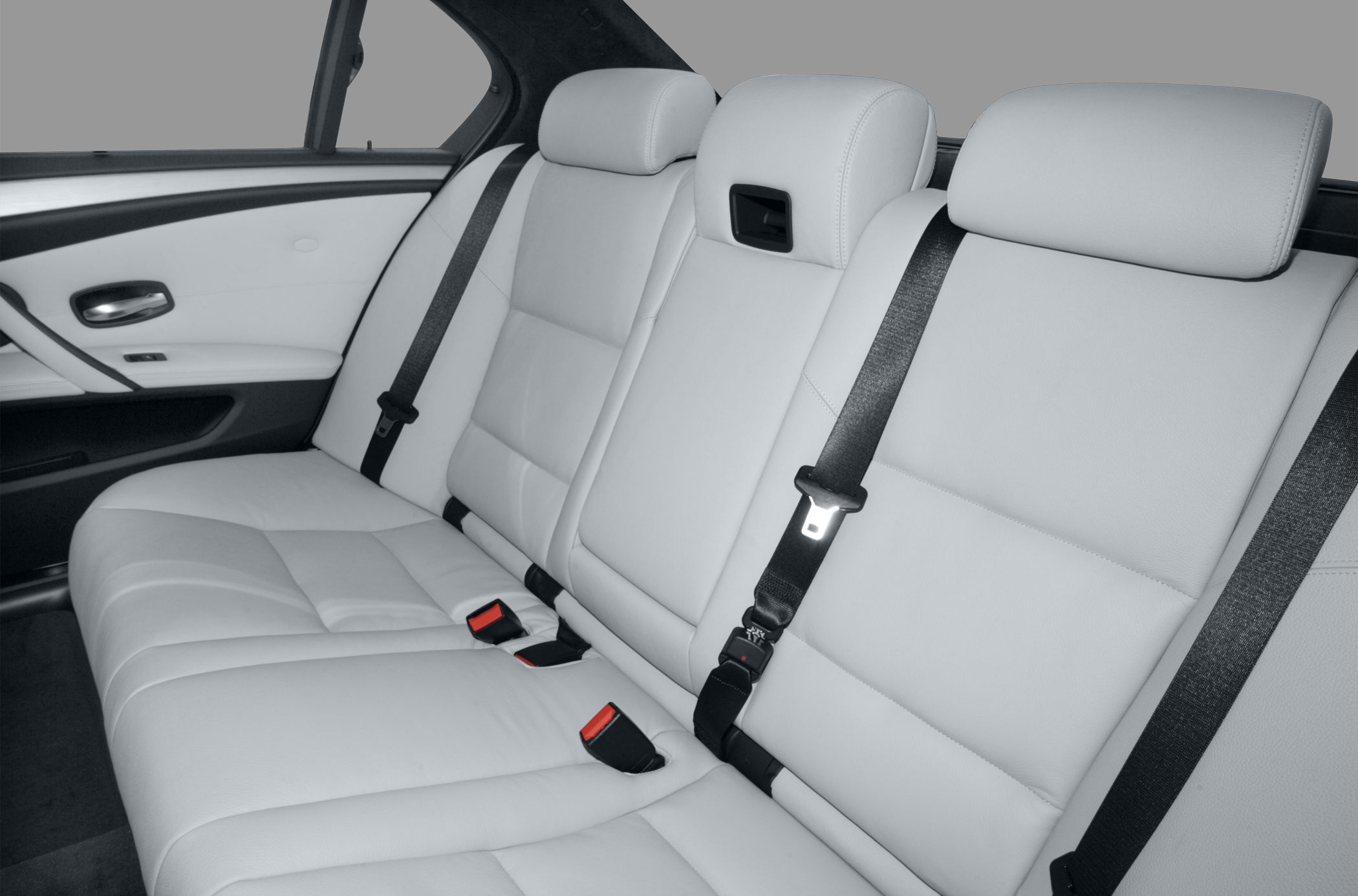 Rear seat with light leather upholstery and seat belts