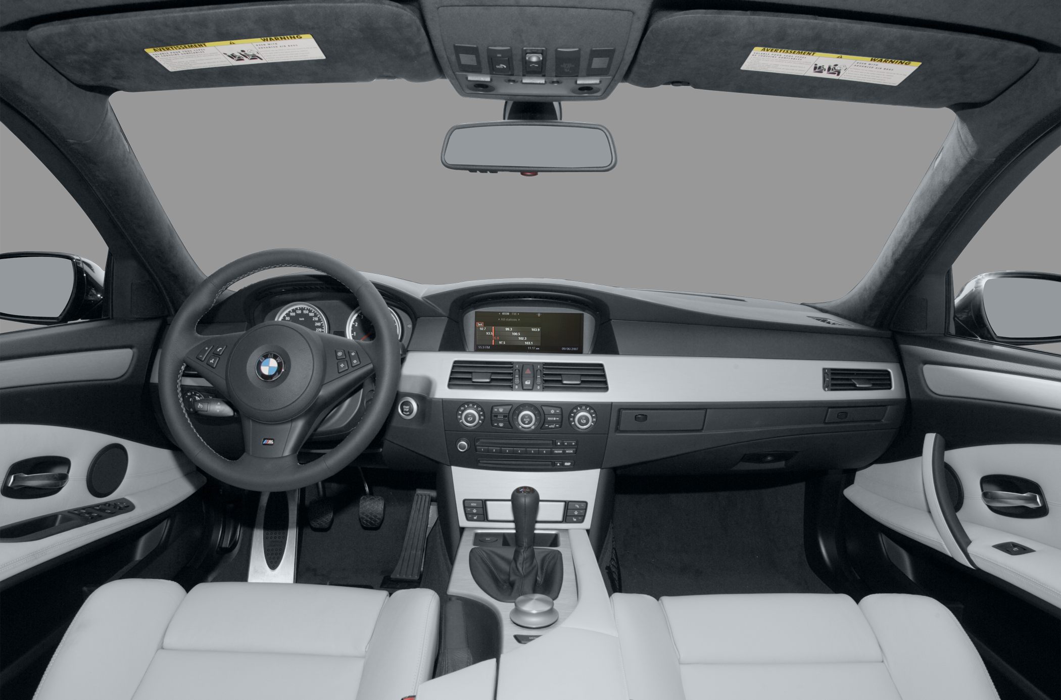BMW M5 (E60) dashboard with manual gearshift and infotainment system