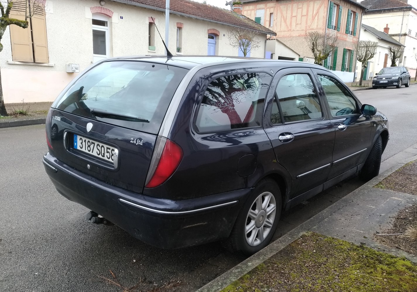 Rear view of station wagon with distinct tail lights and tinted windows