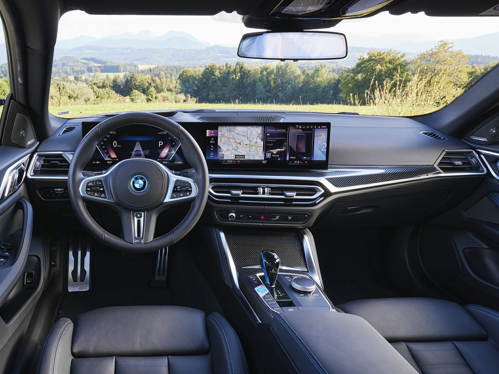 Digital instrument cluster and widescreen infotainment panel with modern steering wheel.