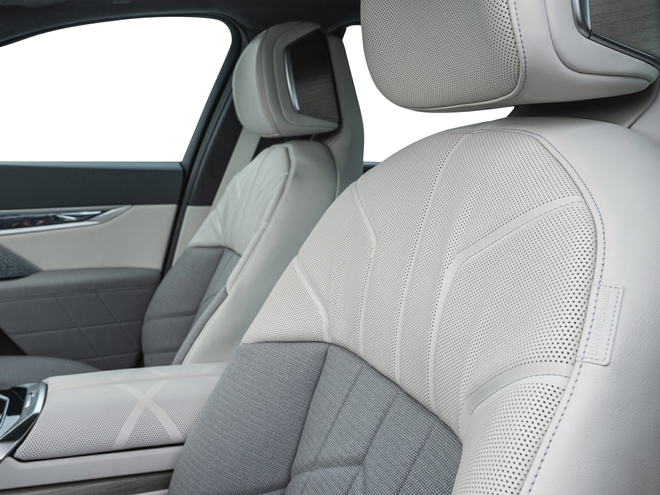 Luxurious perforated leather and fabric front seats with ergonomic design.