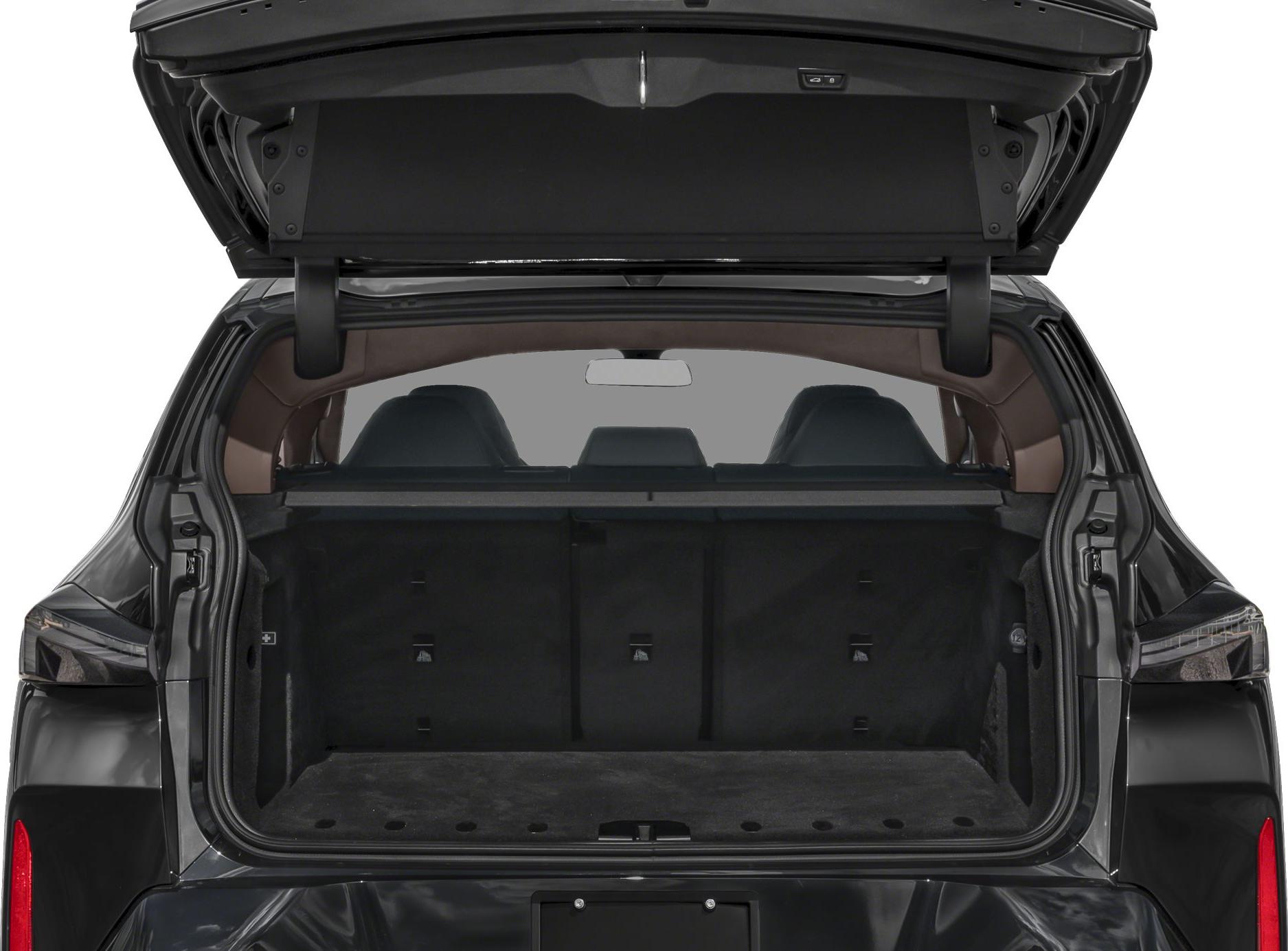 Open rear cargo trunk with spacious interior and visible rear seats