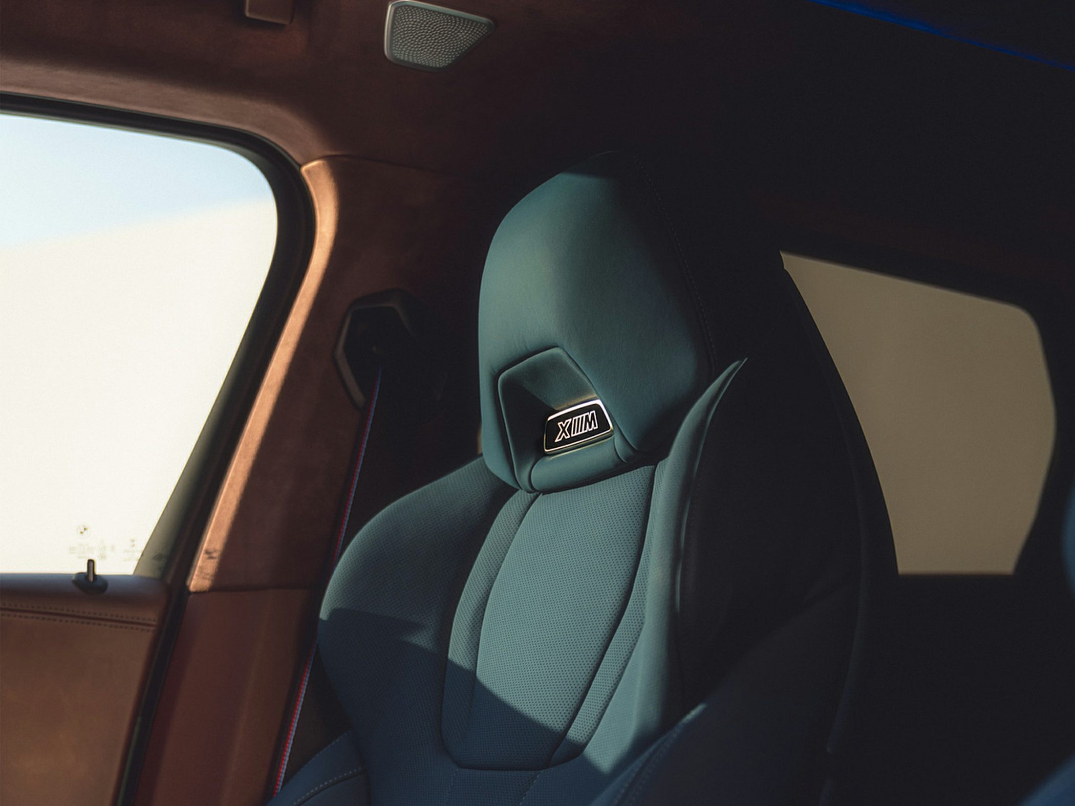 Luxury front seat with XM badge and premium upholstery