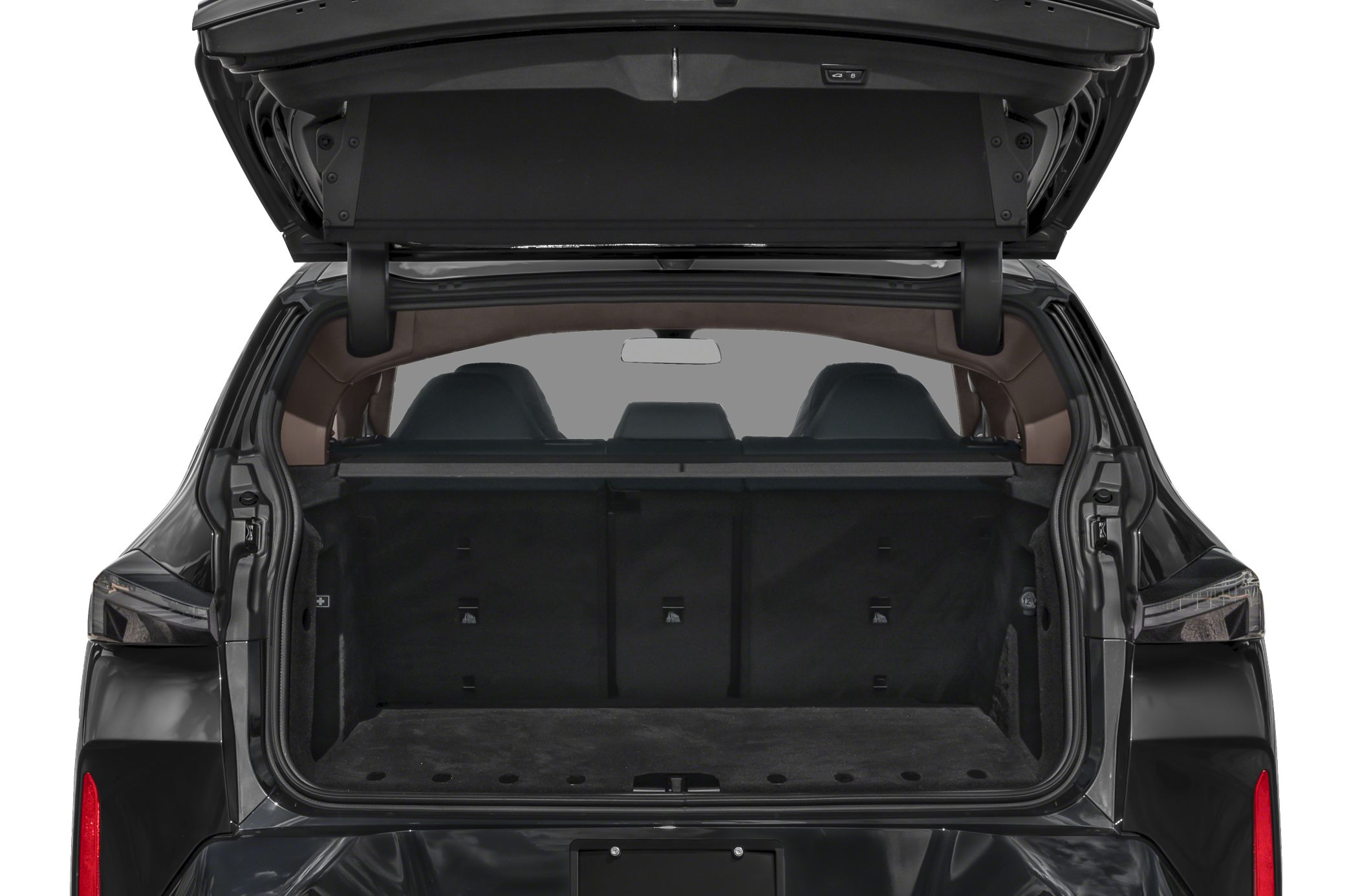 Open rear tailgate revealing spacious cargo space and visible rear seats.