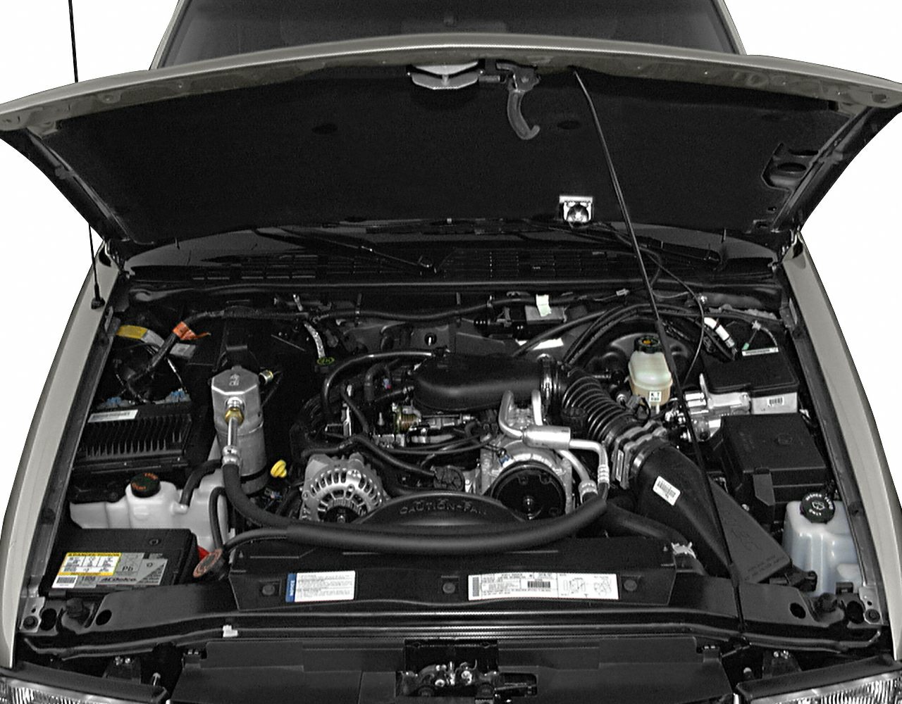 Engine compartment with visible alternator, air intake, battery, and fluid reservoirs