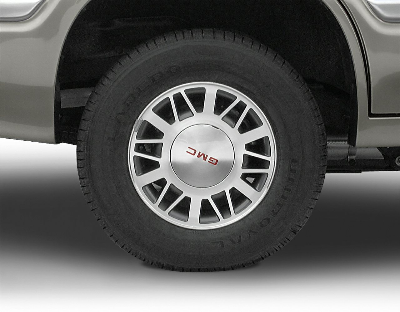 Close-up of 1995 SUV wheel with classic GMC hubcap design