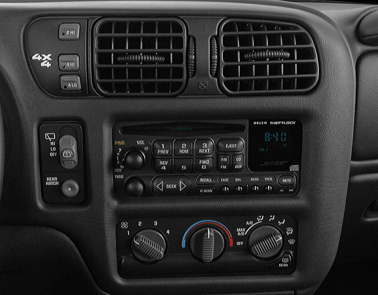 Dashboard with 4x4 controls, radio cassette, air vents, and climate control knobs