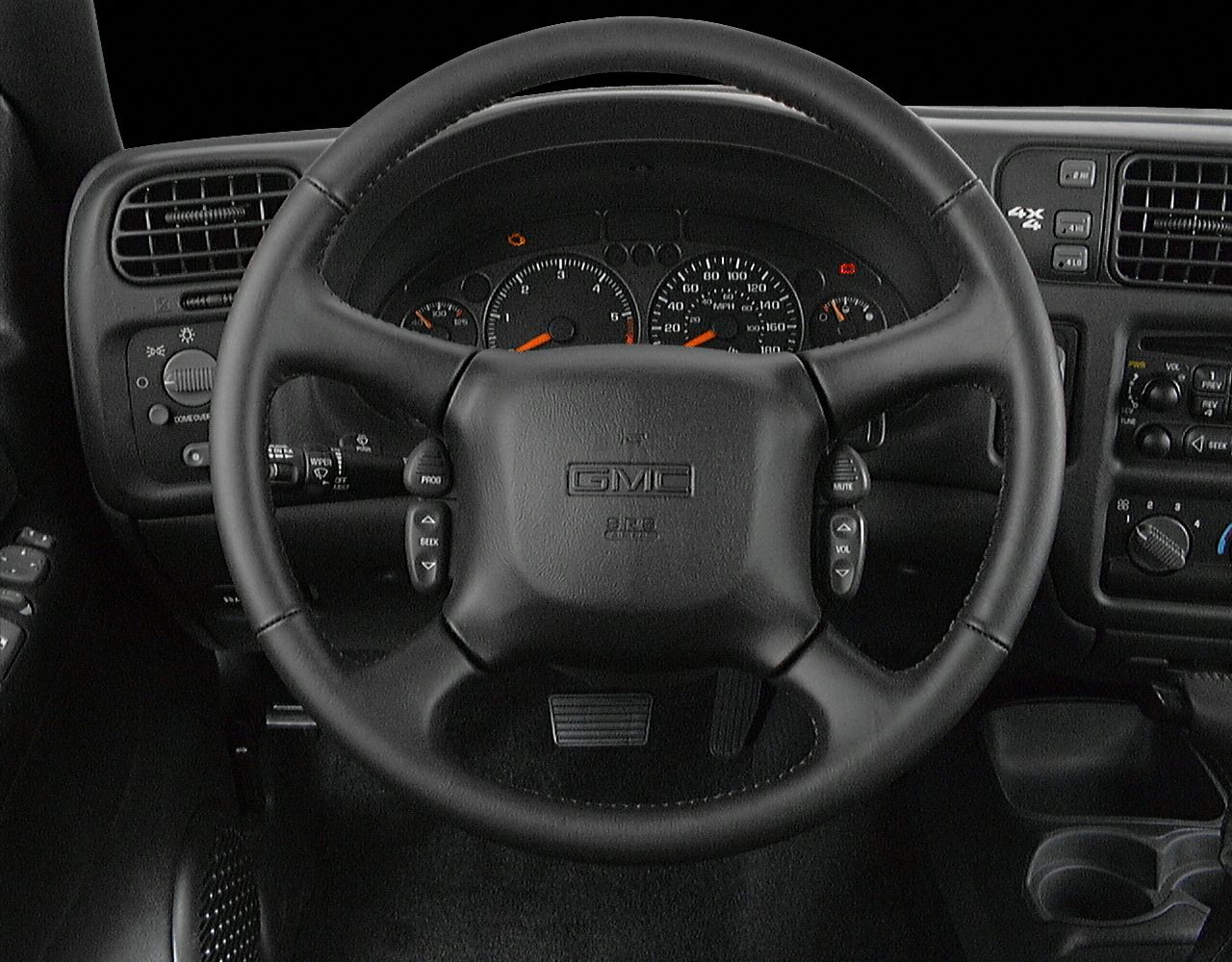 Steering wheel with integrated controls and dashboard instrumentation.