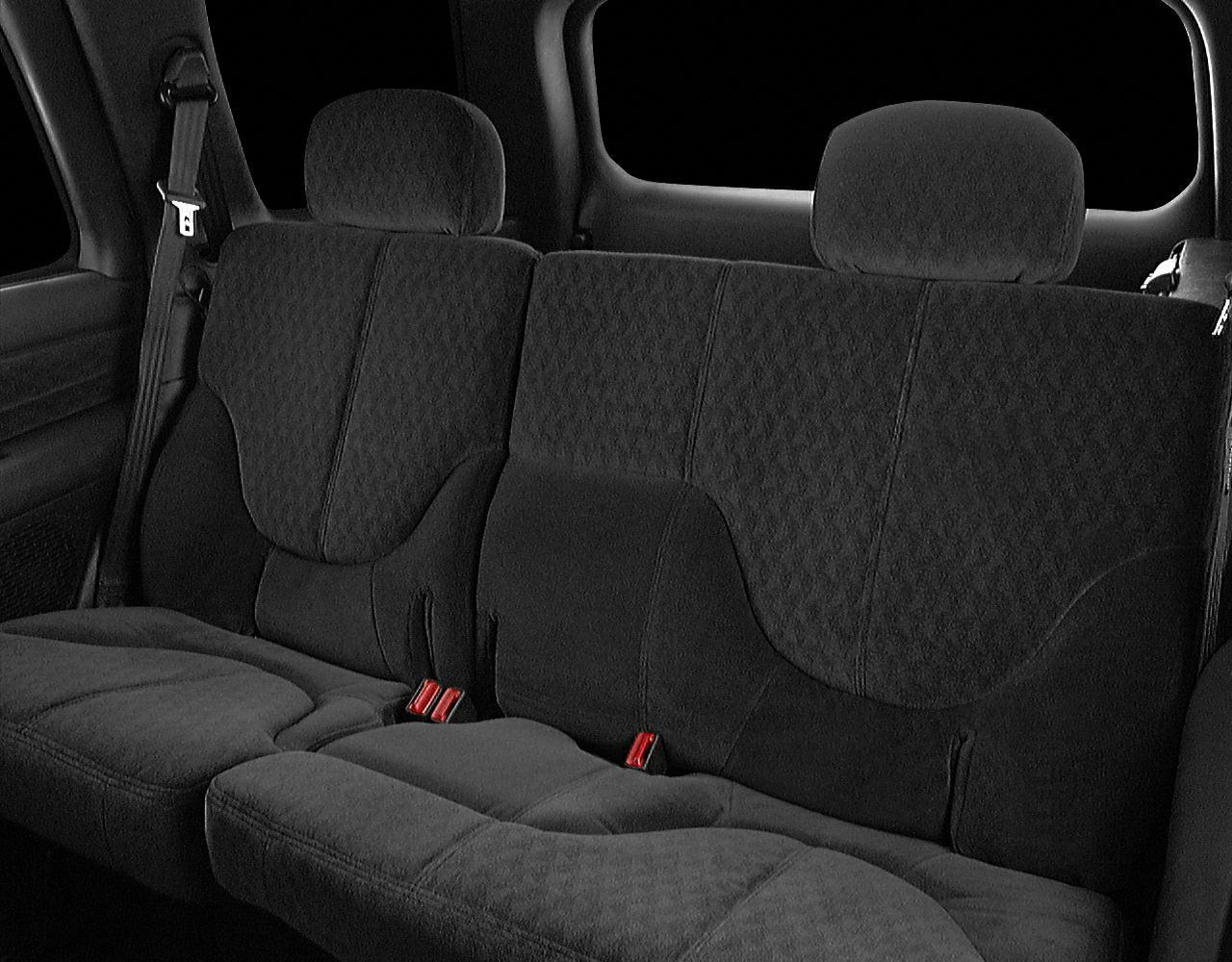 Rear seating upholstery with seat belts and headrests