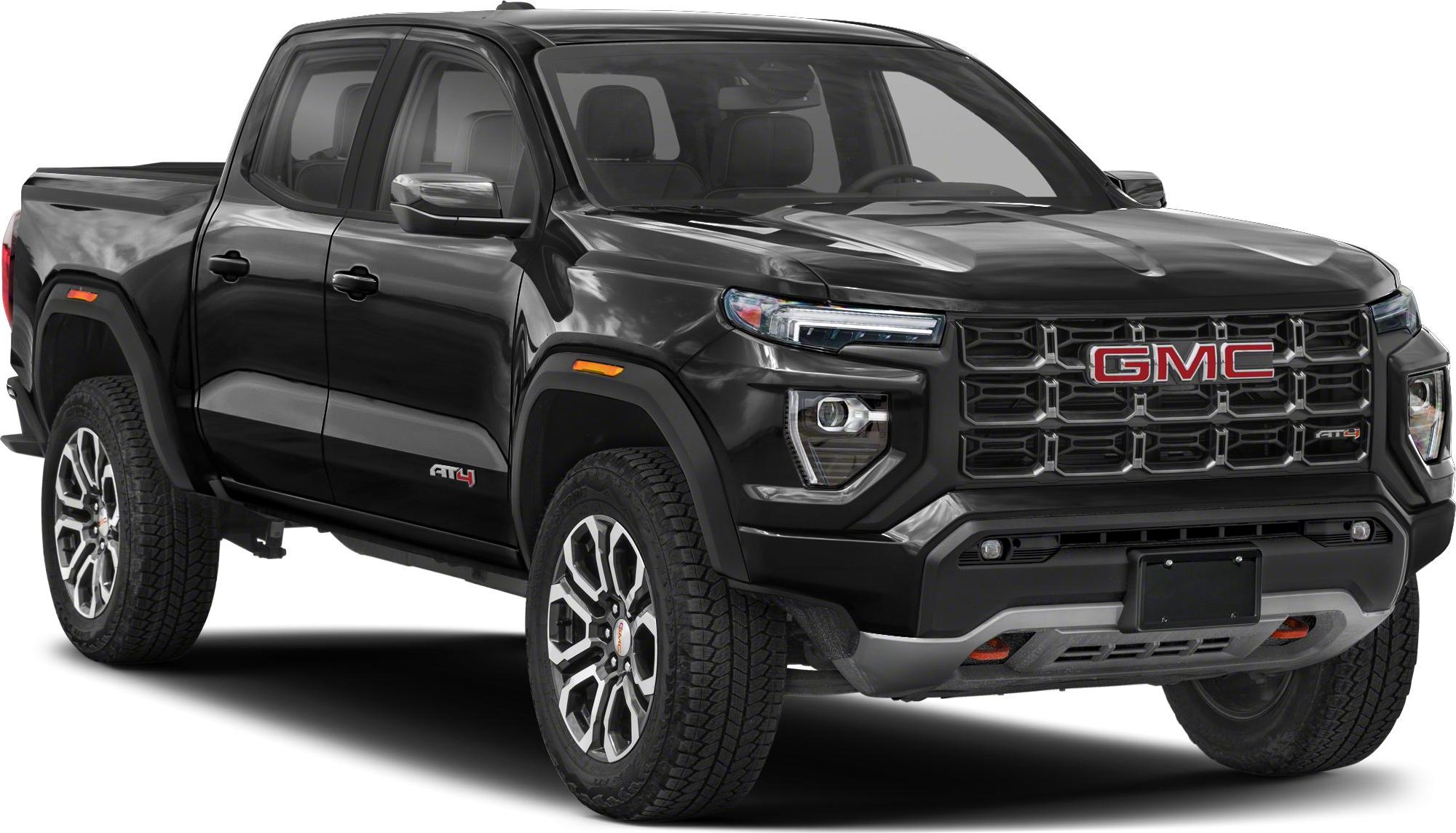 Front angle view showing bold AT4 grille and alloy wheels in black finish
