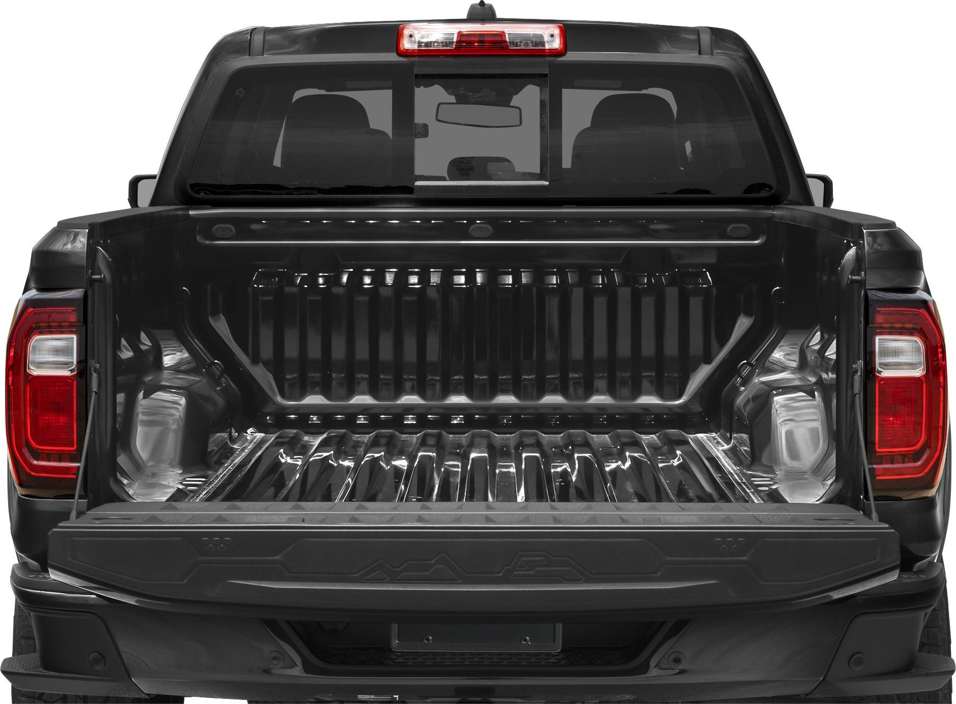 Open truck bed and tailgate with visible rear window and tail lights