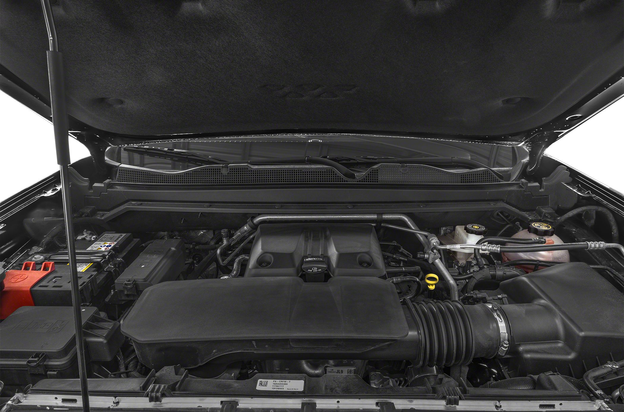 Engine bay showing components, covers, and air intake system