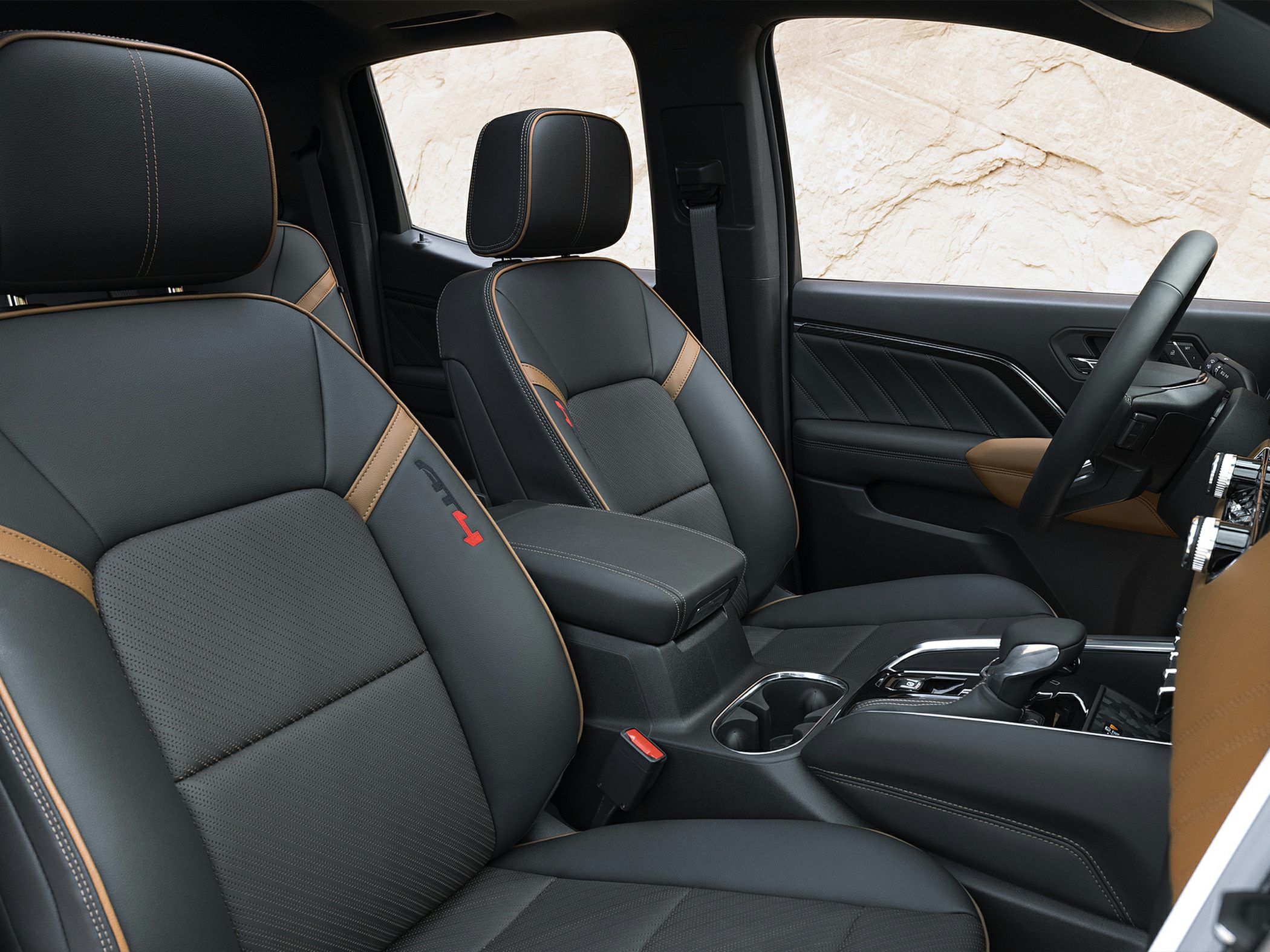 Premium leather seats with brown stitching and modern center console
