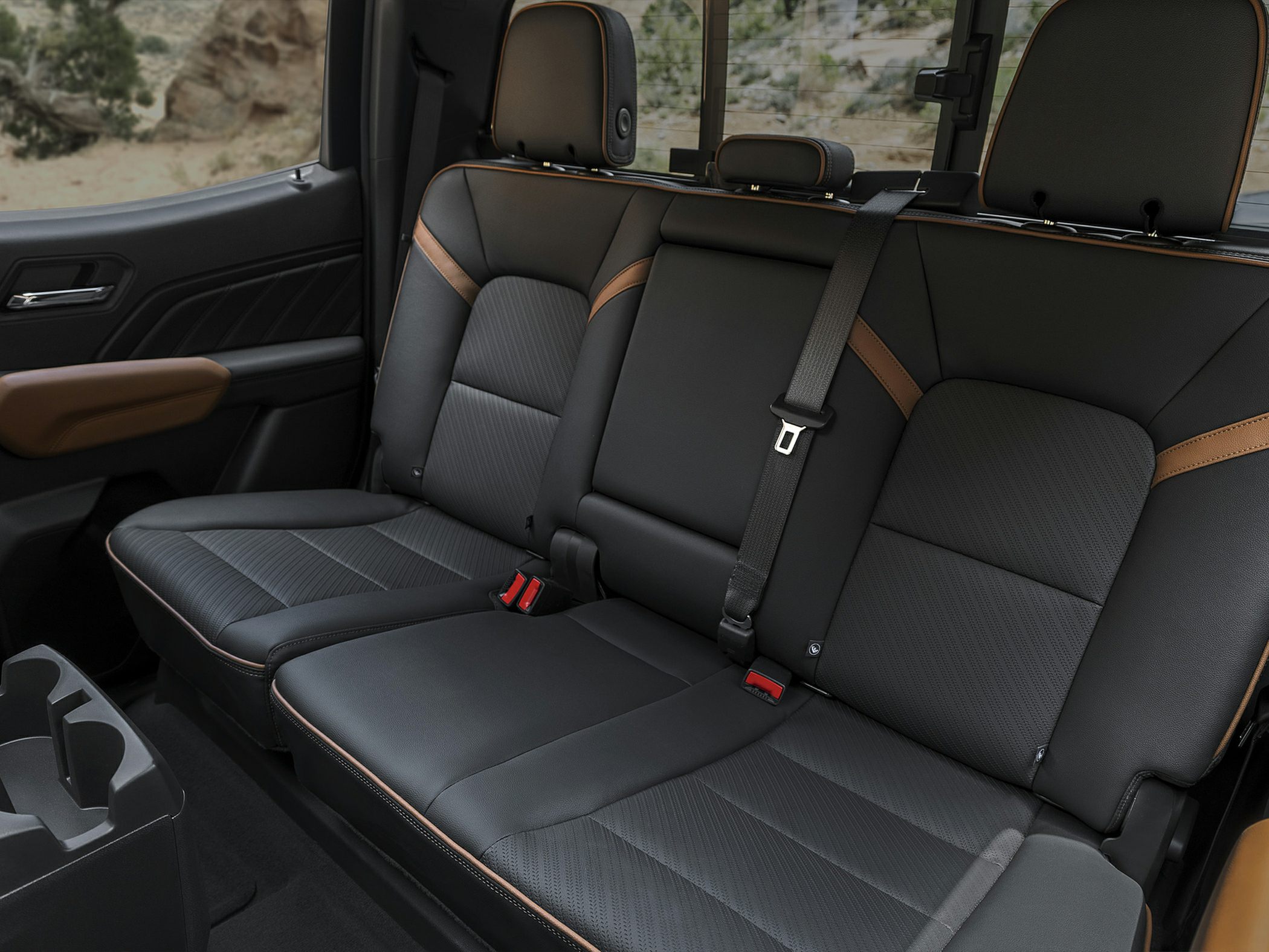 Rear seat with leather upholstery and contrast stitching