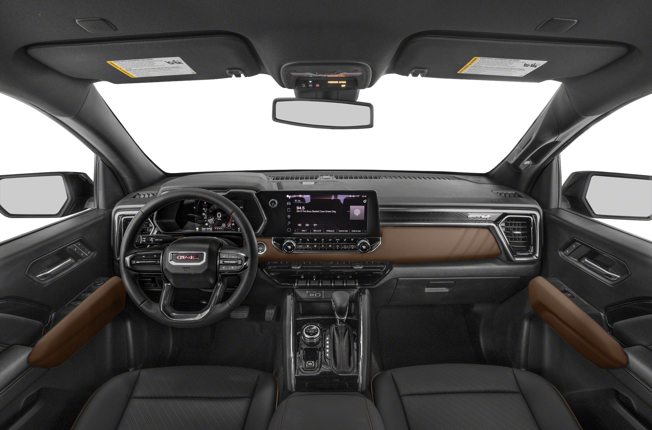 Digital dashboard and infotainment touchscreen with GMC steering wheel and brown accents.