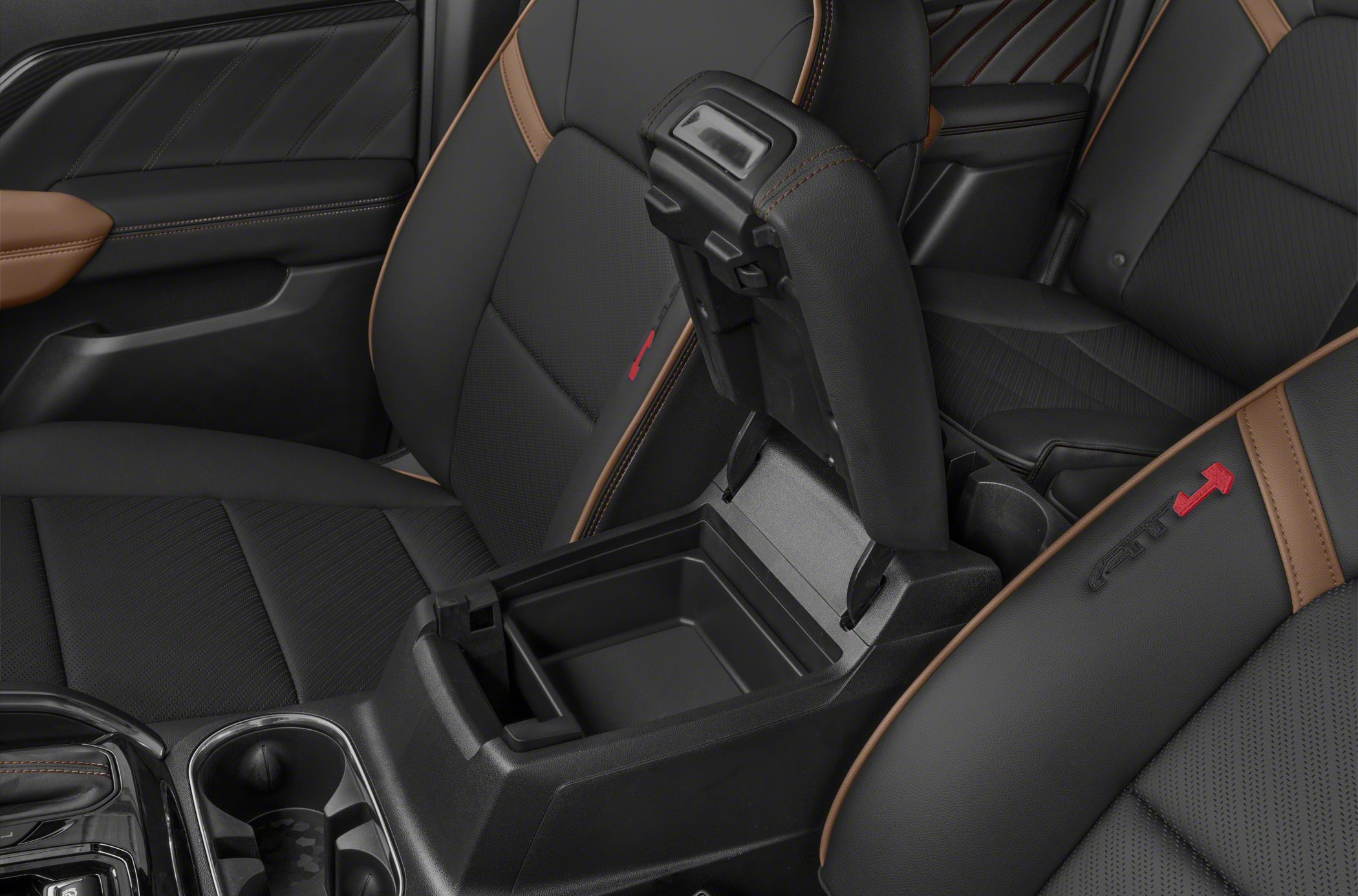 Center console storage with black leather seats and contrast stitching