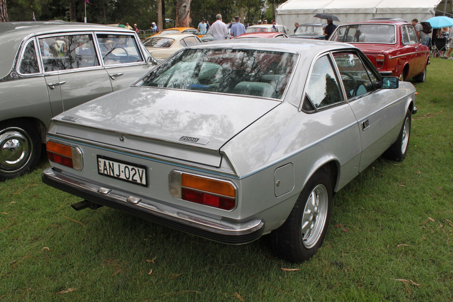 Silver two-door coupe rear with angular lines and rectangular taillights
