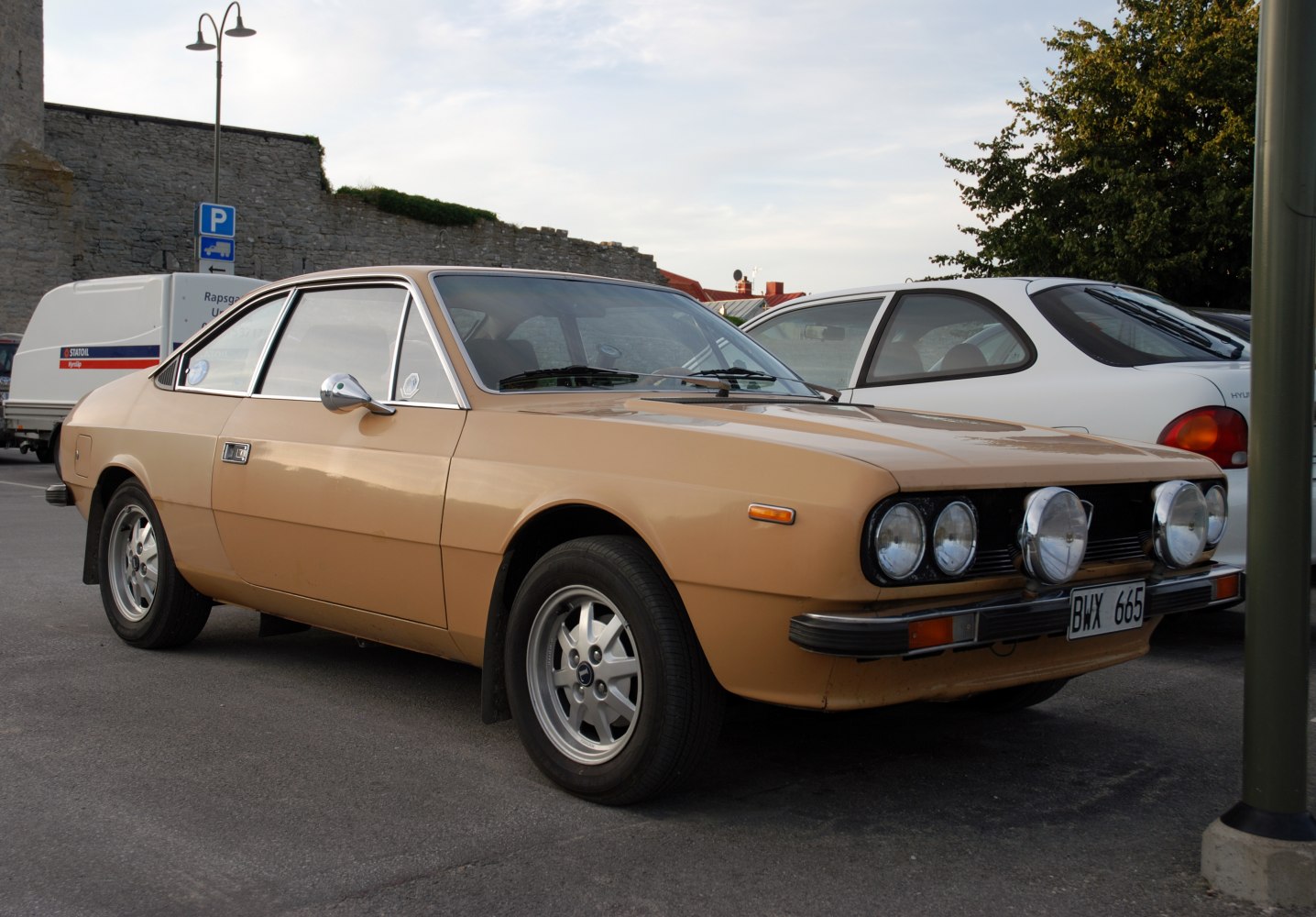 Quadrant front auxiliary lights and sleek coupe body