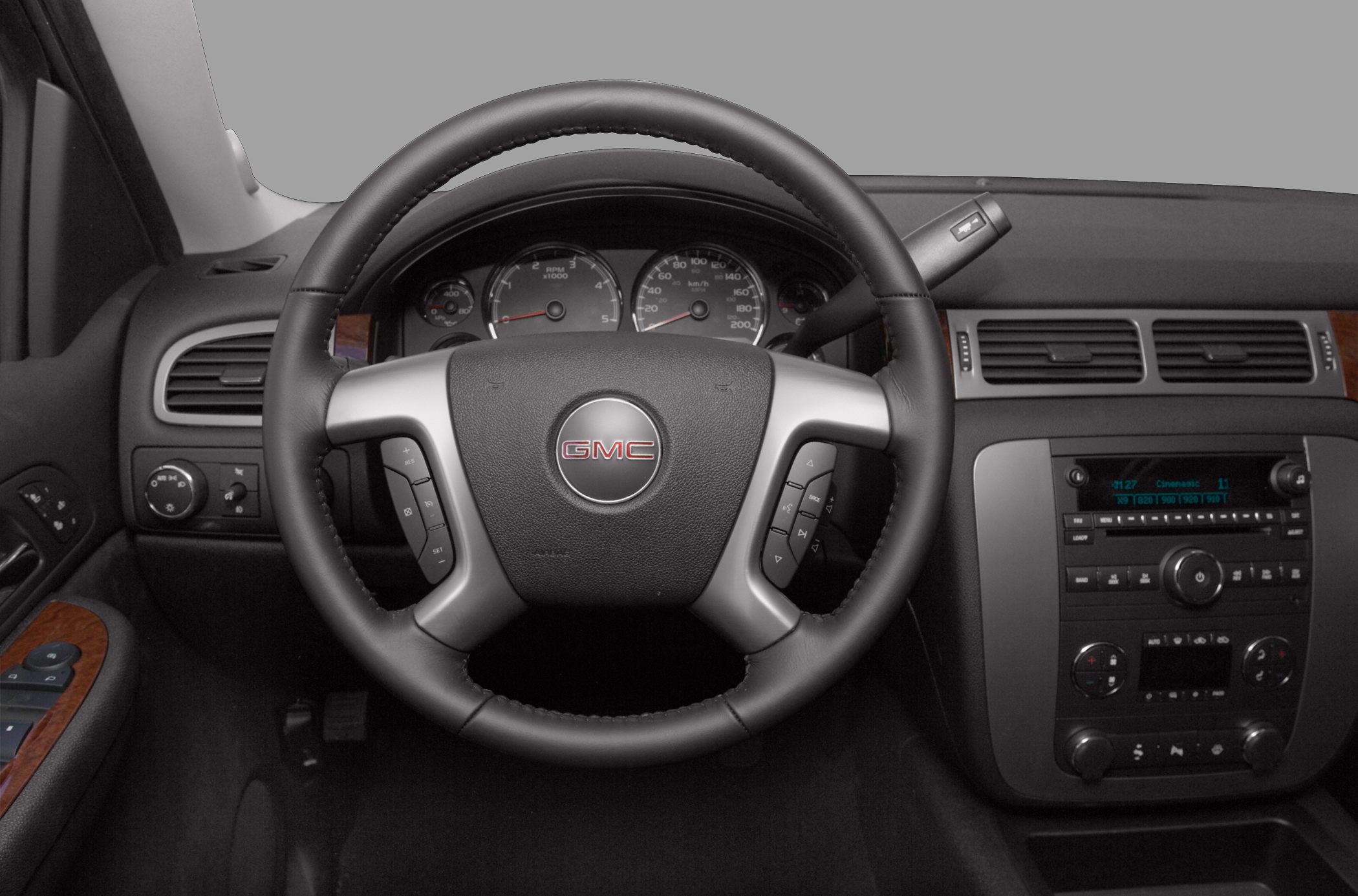 Dashboard and steering wheel with controls and instrument cluster