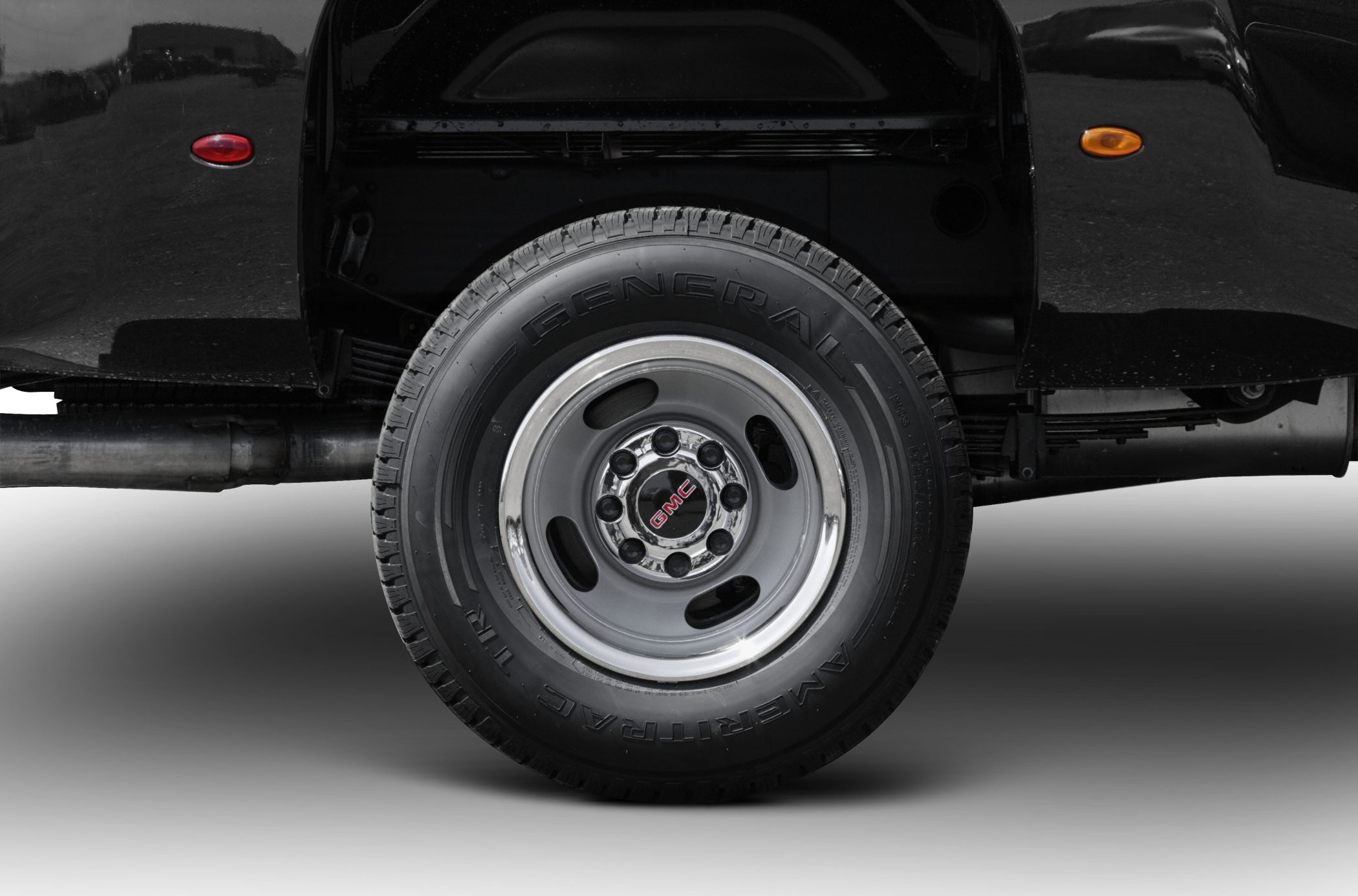 Heavy-duty steel rim with General Ameritrac tire and GMC hub cover
