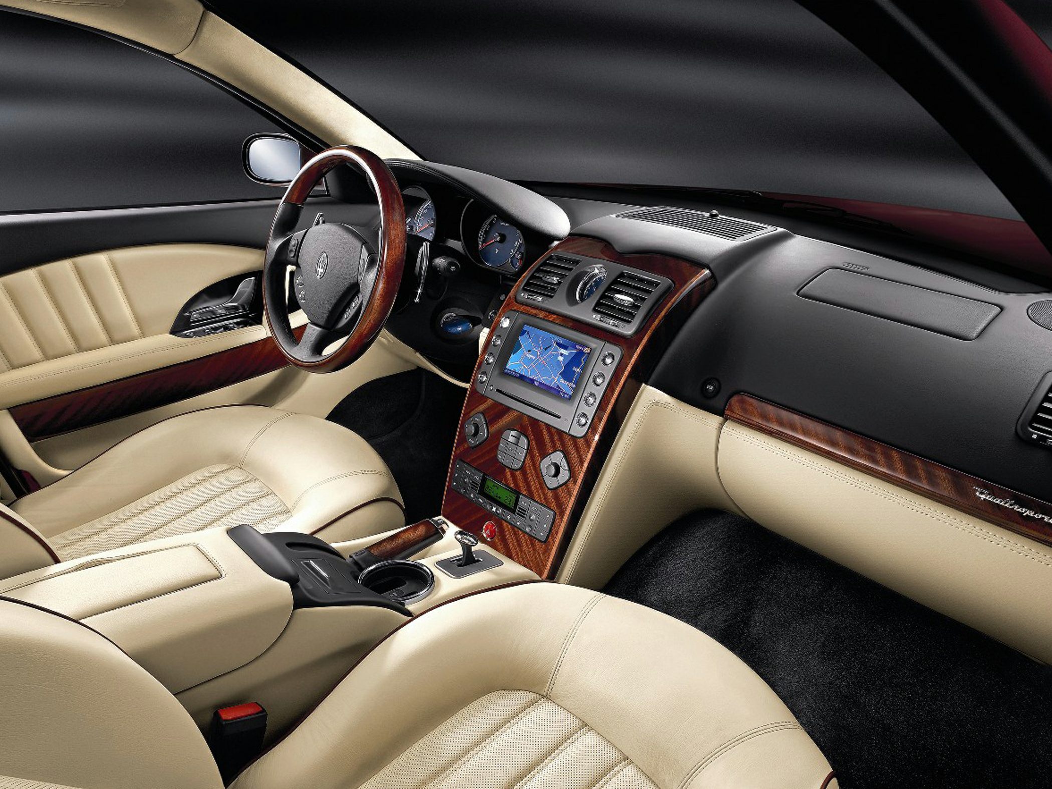 Beige leather interior with wood trim and integrated navigation system