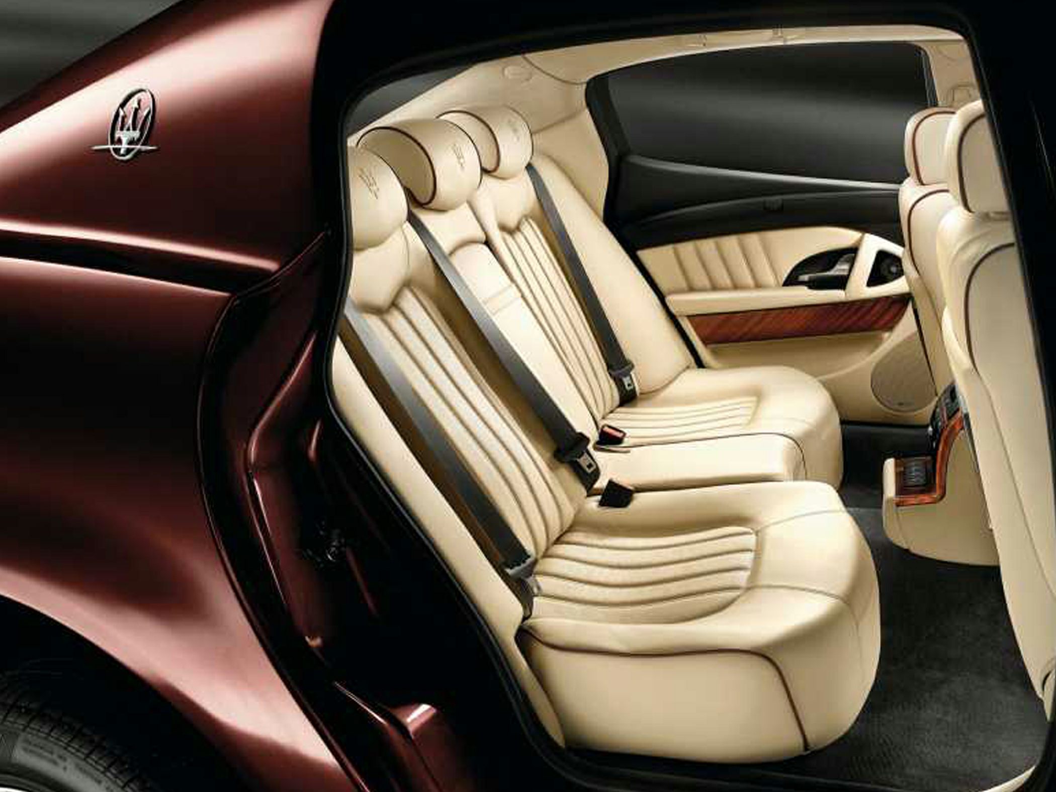 Luxury rear seat with cream leather upholstery and premium detailing
