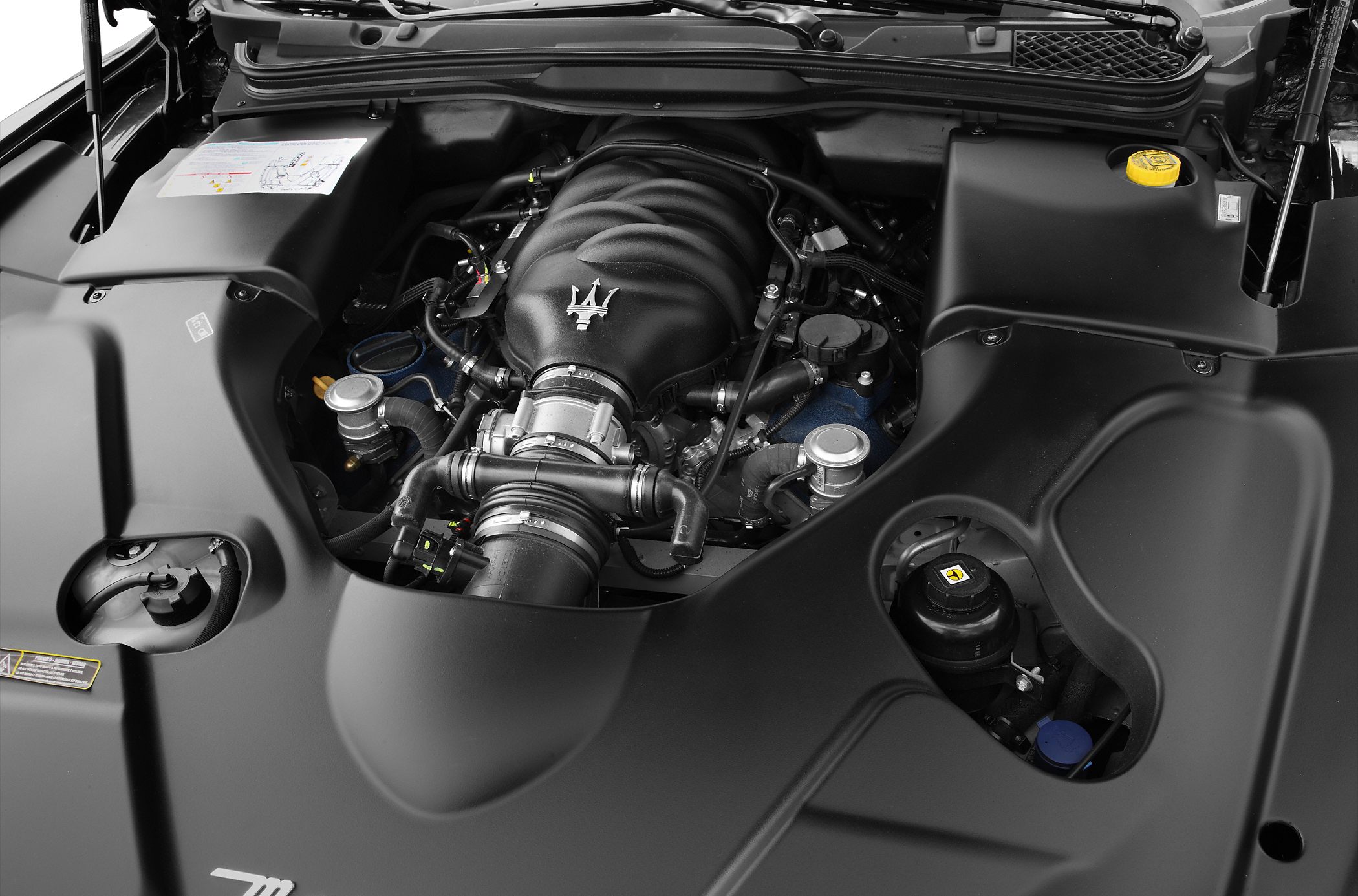 Close-up of a performance engine bay with prominent intake manifold and components