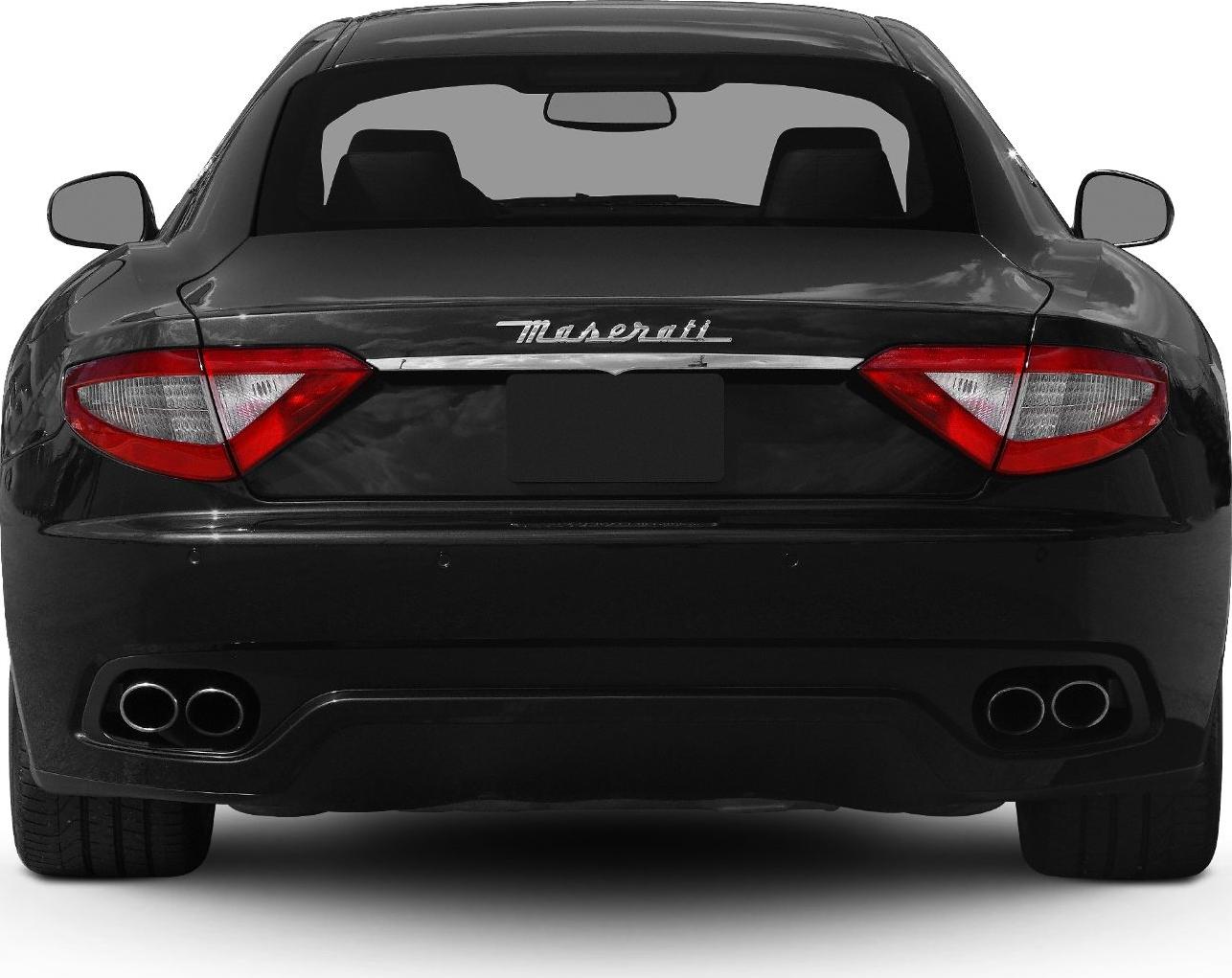Rear view with distinct tail lights and dual quad exhaust pipes
