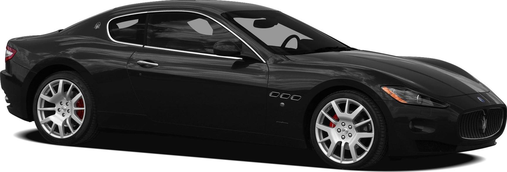 Sleek black coupe with sporty alloy wheels and distinctive front grille