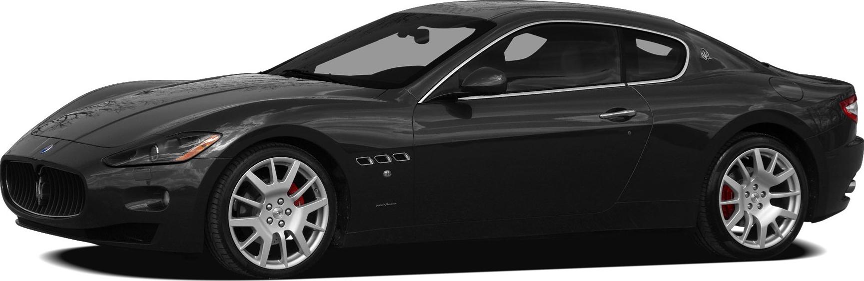 Side profile of sleek coupe with silver alloy wheels and red brake calipers