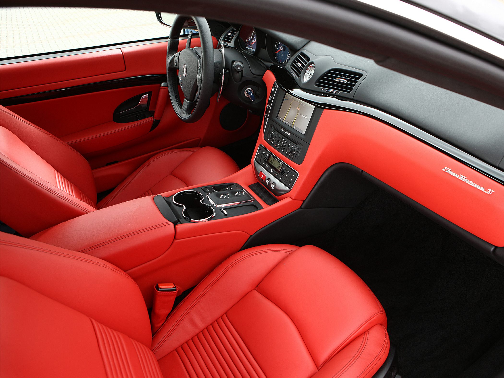 Luxury red leather seats and detailed dashboard design