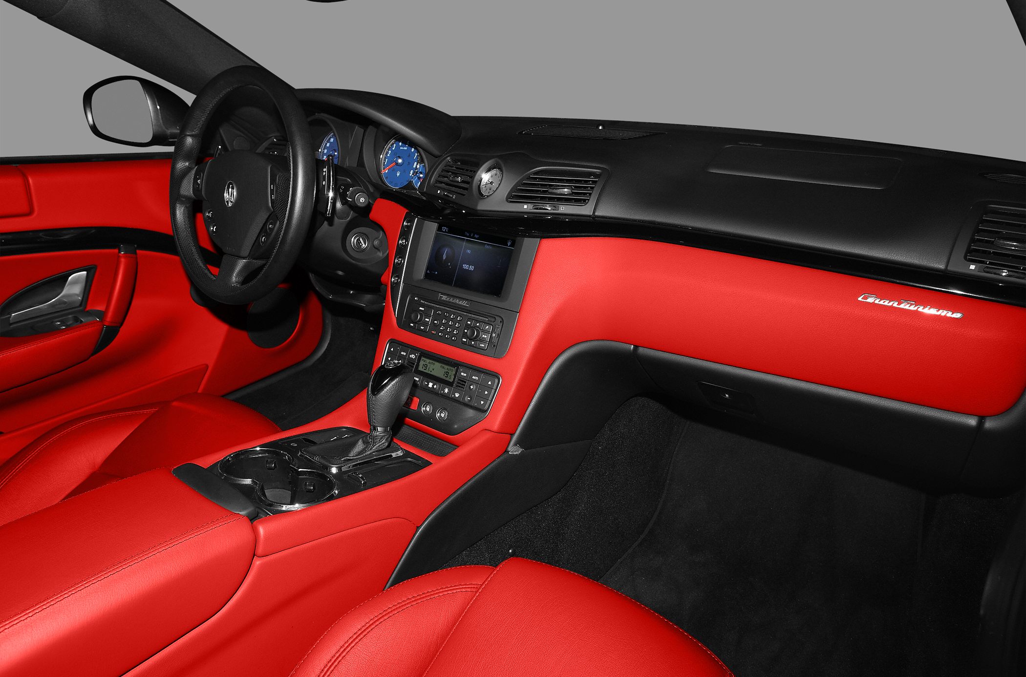 Red leather interior with black dashboard and central console