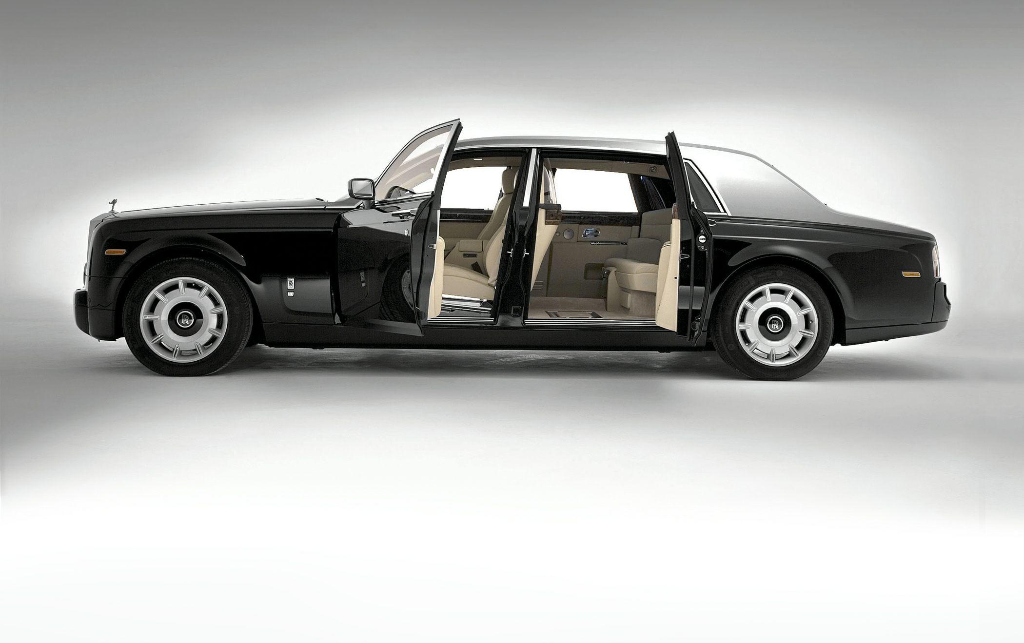 Luxury limousine with rear suicide doors and beige interior.