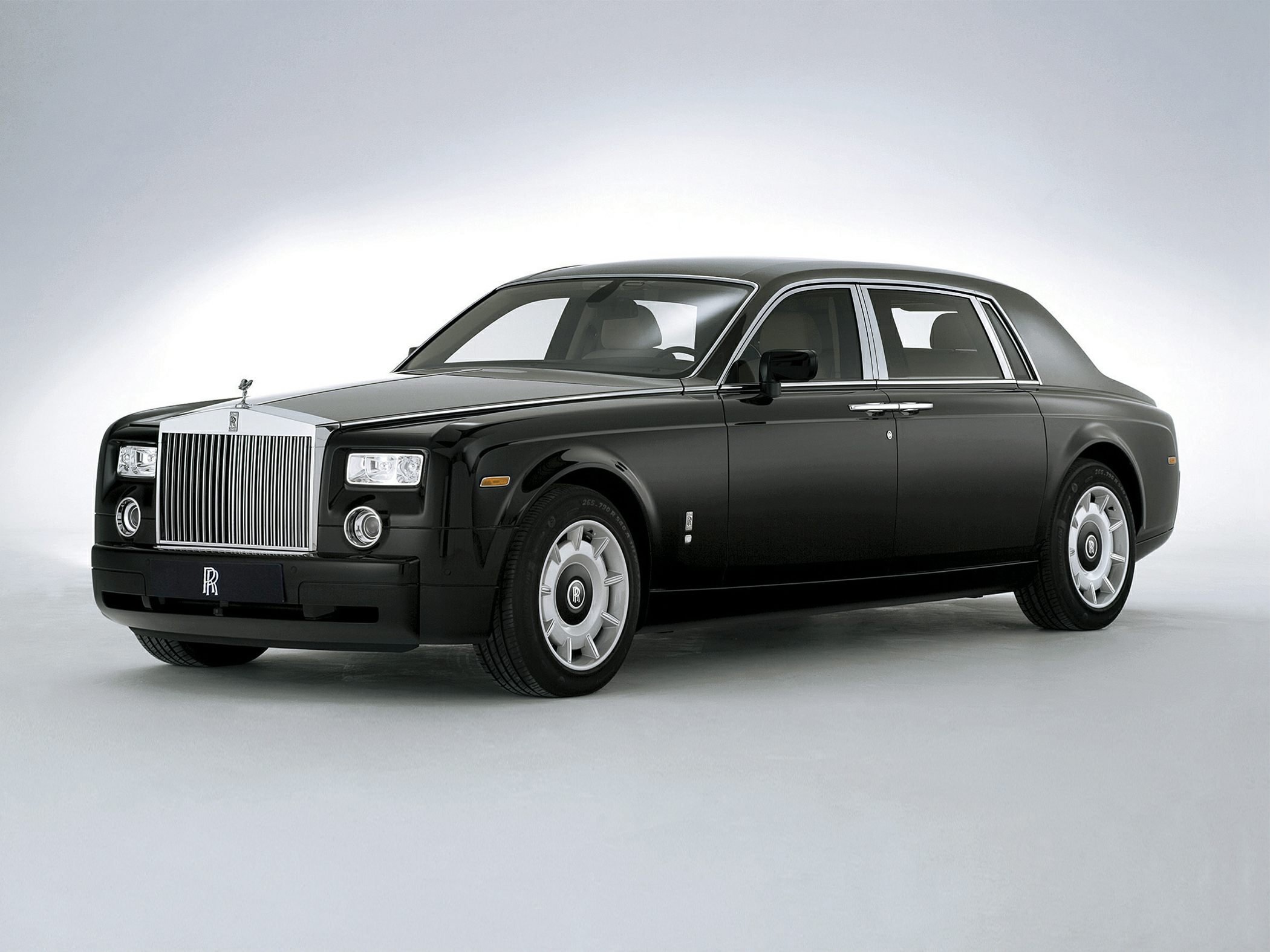 Elongated luxury sedan with classic design and prominent grille