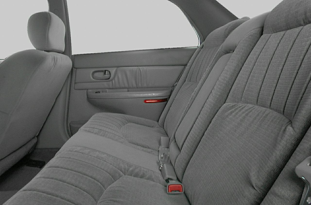 Rear fabric upholstered seating with door panel and seat belts