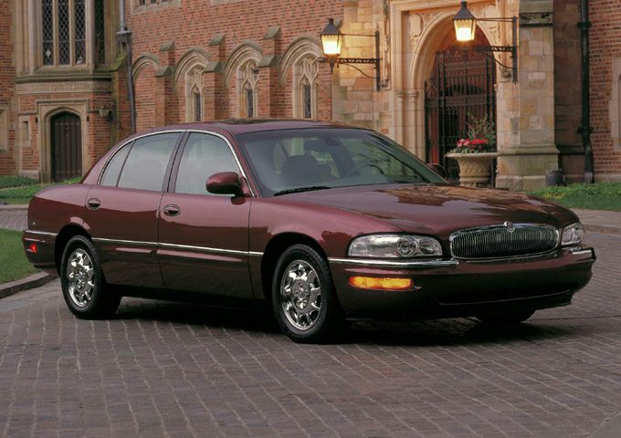 Front-side view of a classic sedan with chrome wheels