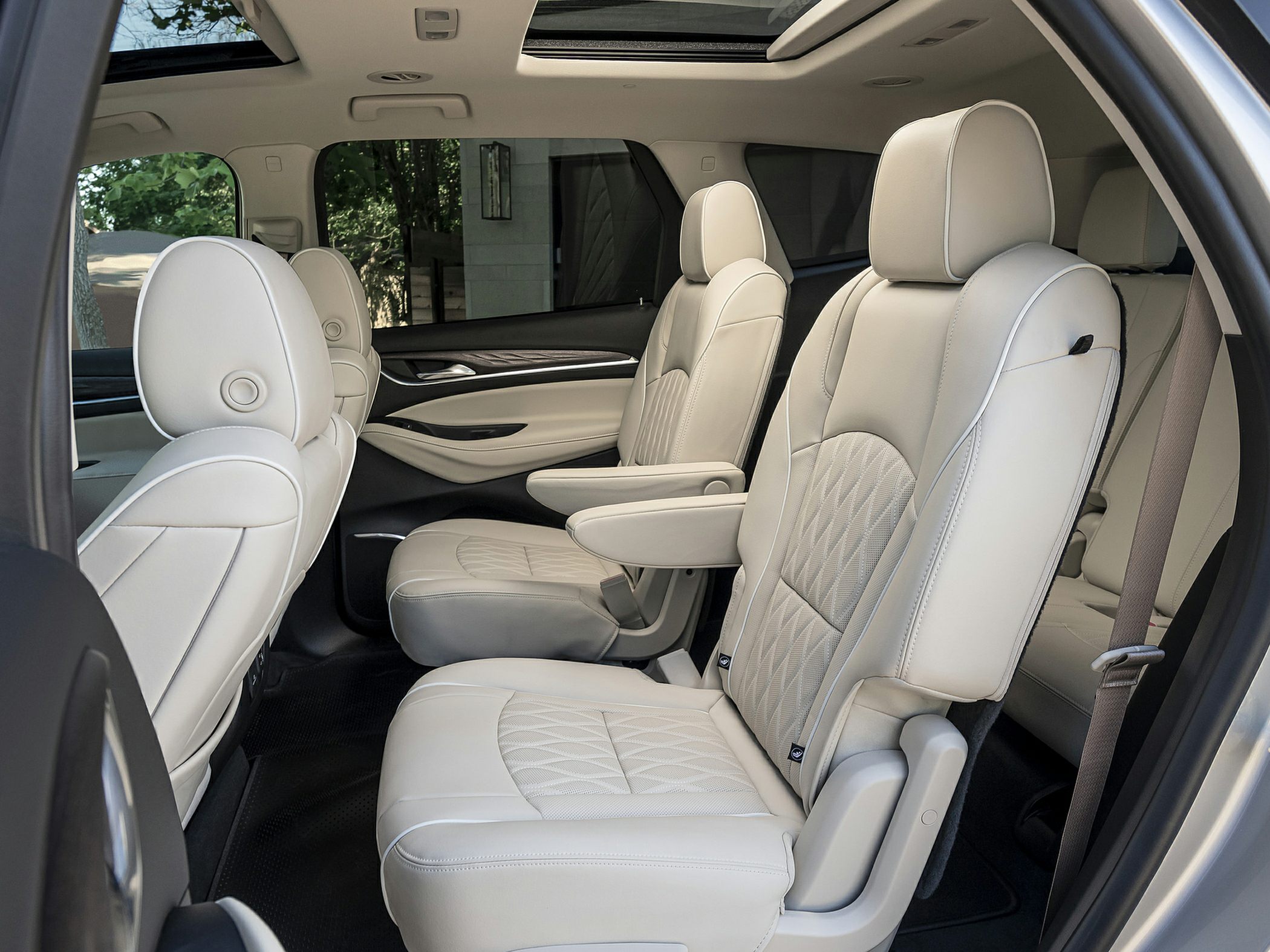 Luxurious beige leather captain seats with panoramic sunroof