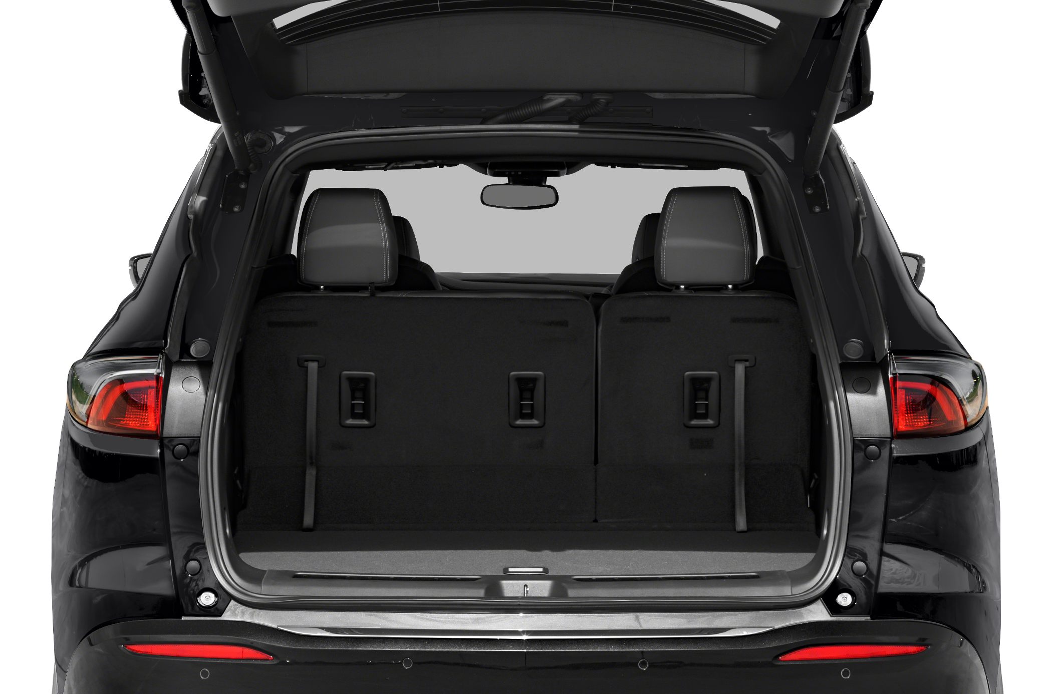 Spacious rear cargo area with foldable seats and visible headrests.