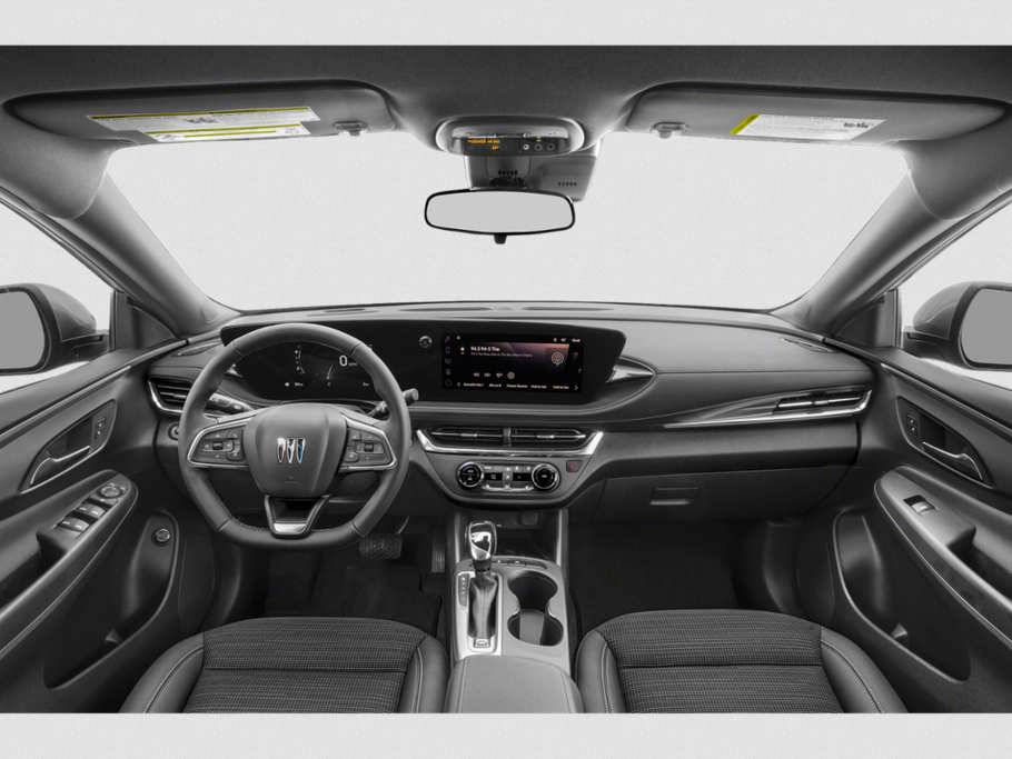 Interior dashboard and steering wheel with digital displays and ergonomic controls