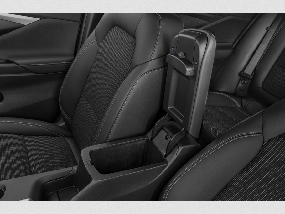 Black seats with textured fabric and open center console storage