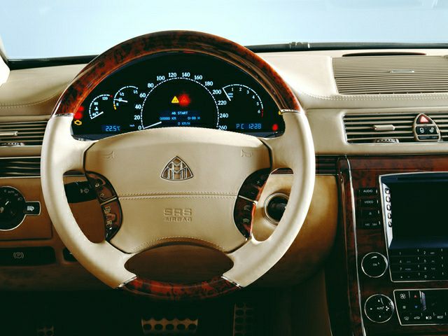 Luxury steering wheel and illuminated dashboard with wood trim