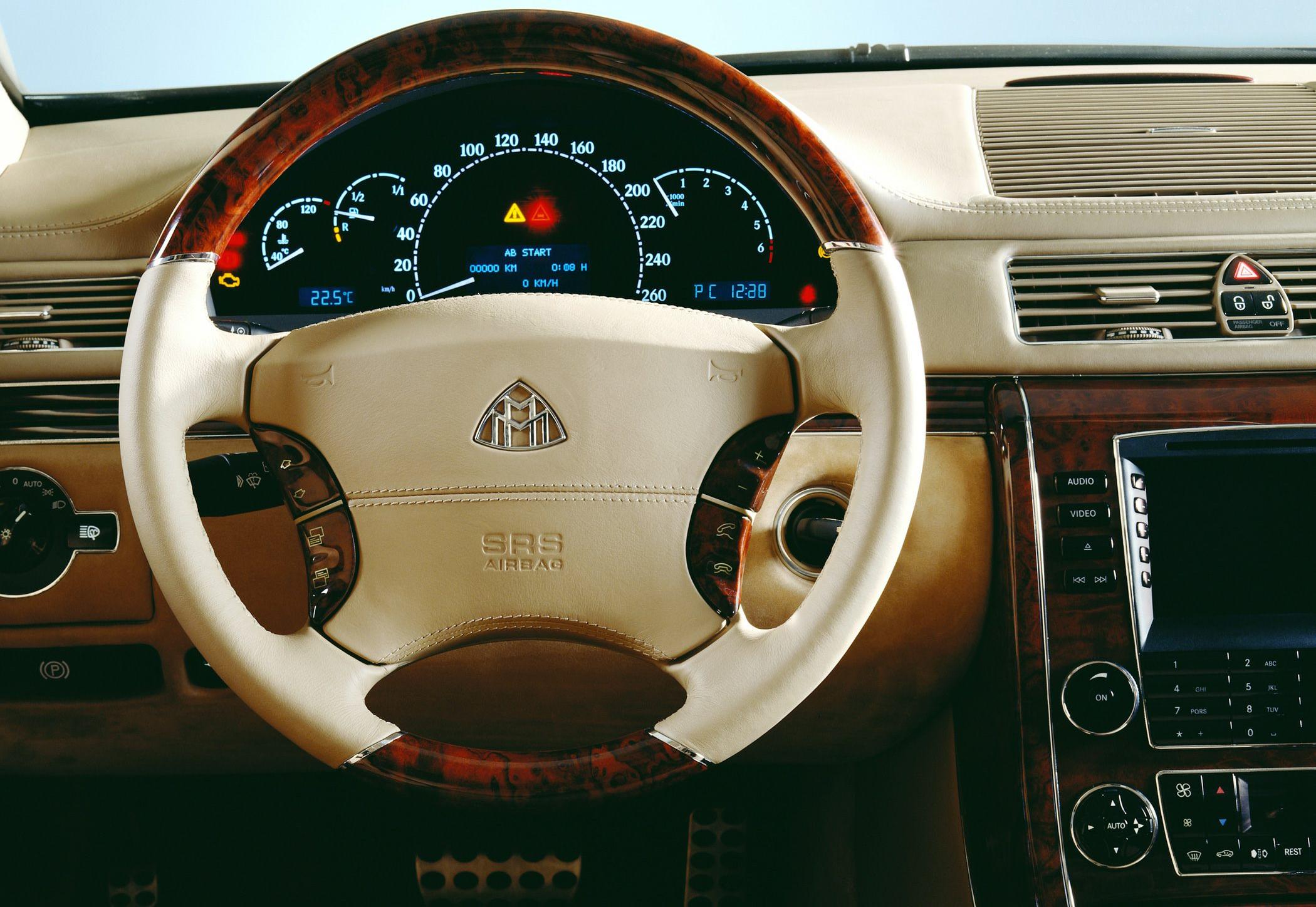 Luxury steering wheel with wood trim and advanced dashboard instrumentation