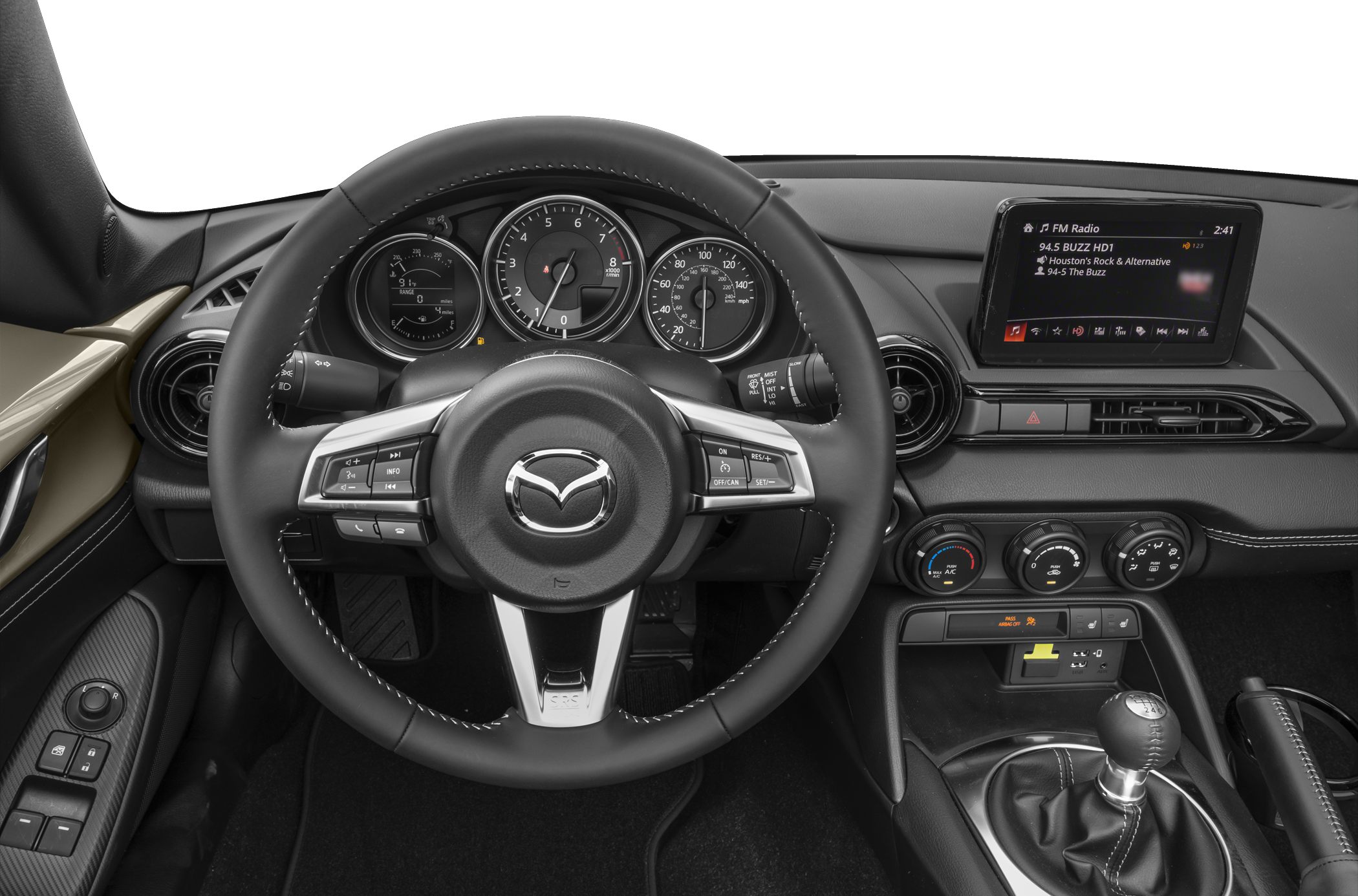 Steering wheel, analog gauges, infotainment, manual gear shifter