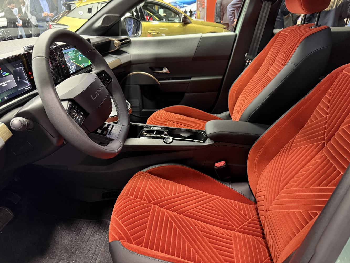 Red patterned seats with digital dashboard and modern steering wheel