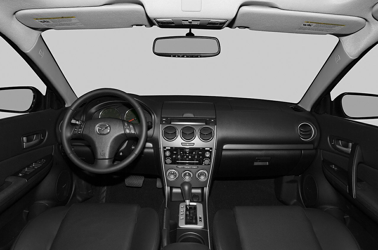 Dashboard, steering wheel, center console, and gear shift interior elements