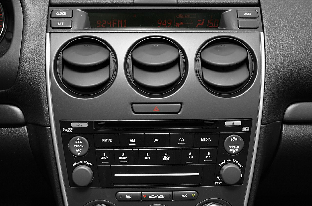 Central dashboard console with air vents and control buttons
