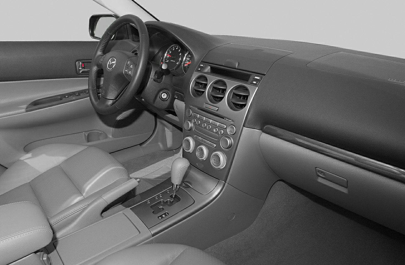 Interior dashboard and steering wheel with control panel and gear shifter