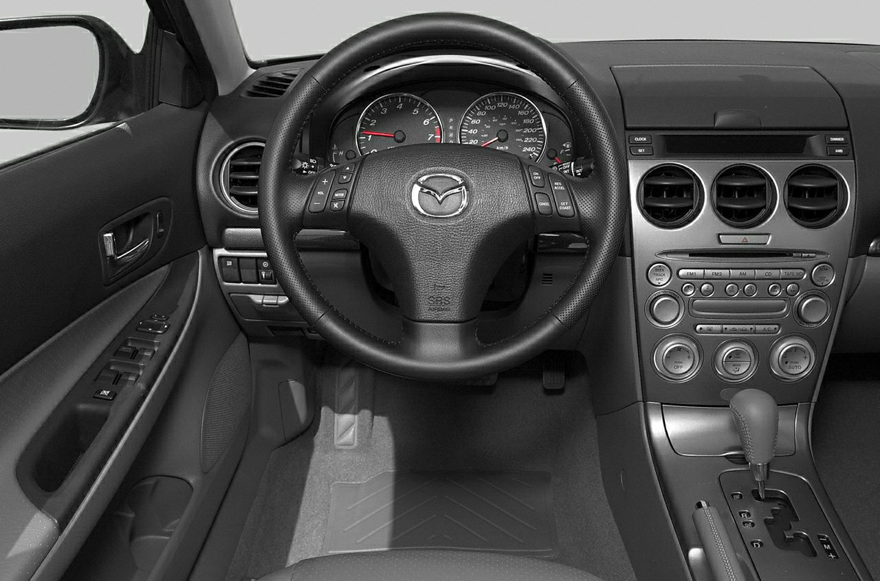Steering wheel, dashboard, and center console with audio and climate controls