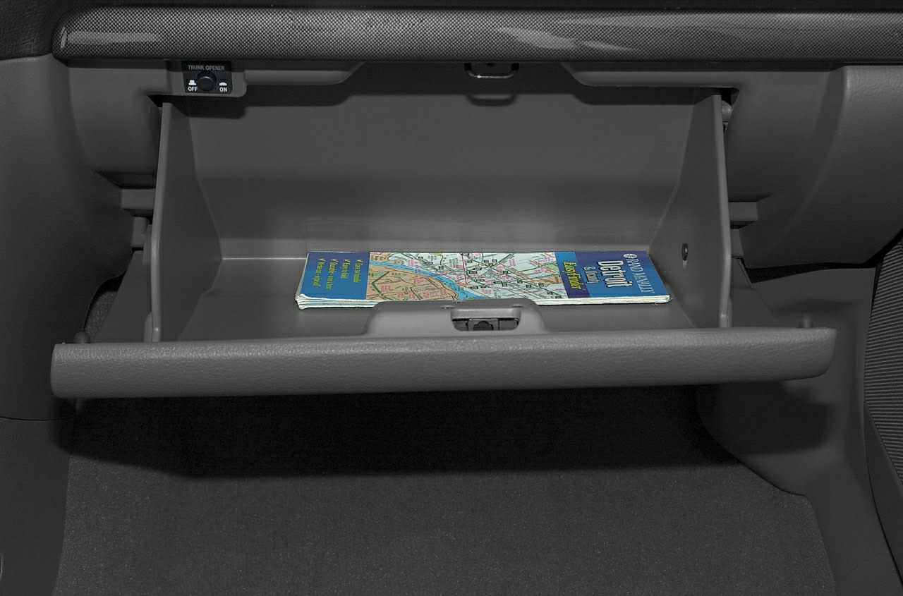 Open glove compartment with a map inside